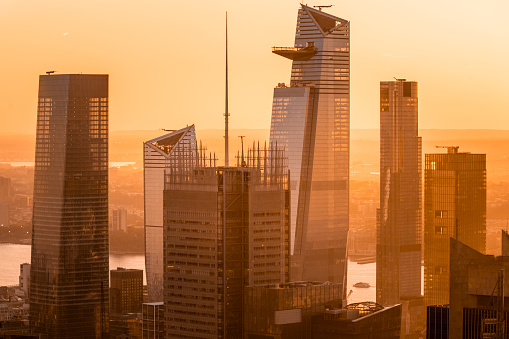 Modern corporate buildings in Manhattan in the light of the setting sun, New York, USA.