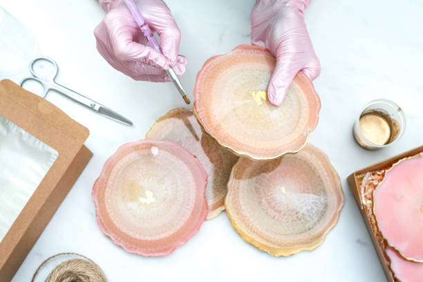 istock Creativity and craft. A young girl creates coasters from resin. Gift wrapping. Decorative packaging. Idea for business. Remote work, work at home. Art coasters. 1238589640