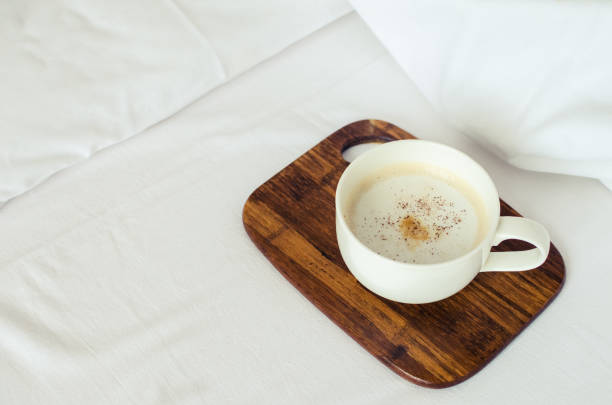 istock Cup of coffee on the bed 1238601374