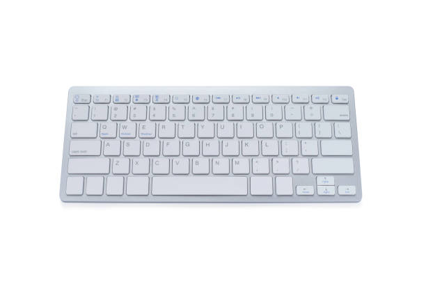 istock Top view from above of Modern computer keyboard isolated on white background with clipping path. material made from aluminum and plastic. It is an electronic device used for business and internet communication. 1238636359