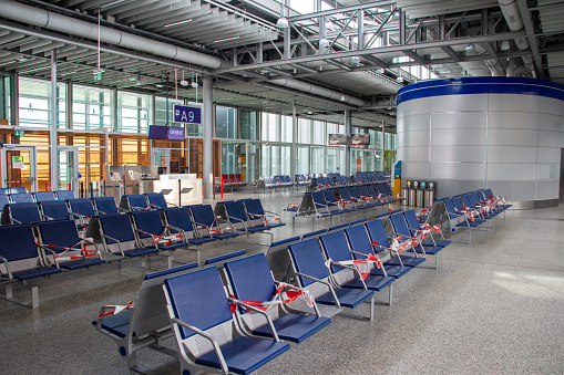 A Geneva Airport (Genève Aéroport) passenger terminal in Geneva, Switzerland is empty on May 30, 2020, with few flights operating each day from the international airport during the coronavirus disease (COVID-19) pandemic.