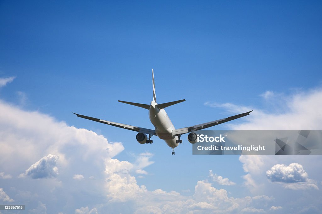 Jet Airliner About to Land, Cloud Background  Air Vehicle Stock Photo