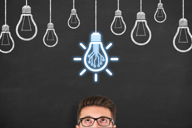 istock Innovative idea concepts with light bulbs on a chalkboard background 1238682029