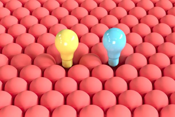 istock Outstanding Blue and yellow Light bulb floating among red light bulbs from top view. Creative Concept idea. 3D Render. 1238685650