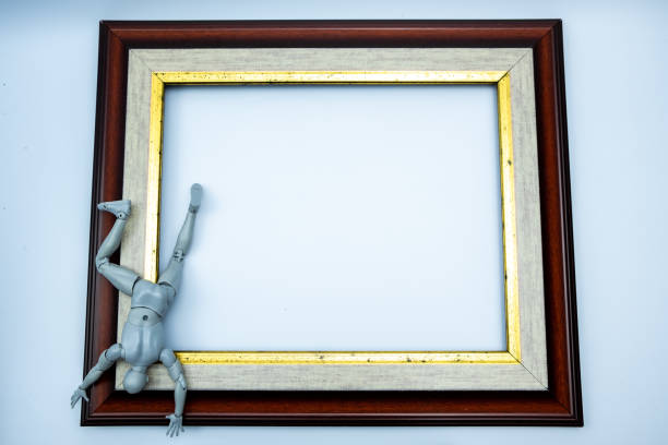 istock Mini figure try to escape from the frame, comfort zone concept 1238695919
