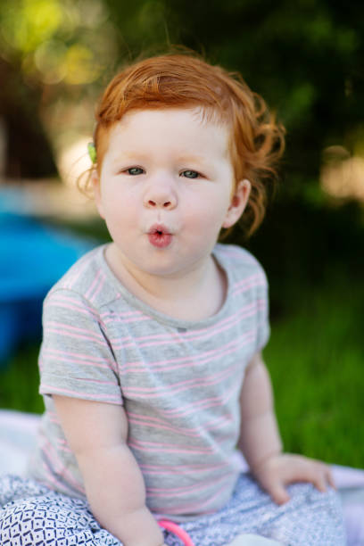 istock Gorgeous cute red haired little girl 1238698981