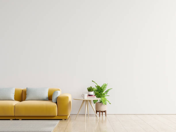 istock Empty living room with yellow sofa, plants and table on empty white wall background. 1238712369