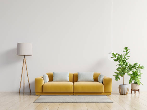 istock Empty living room with yellow sofa, plants and table on empty white wall background. 1238712880
