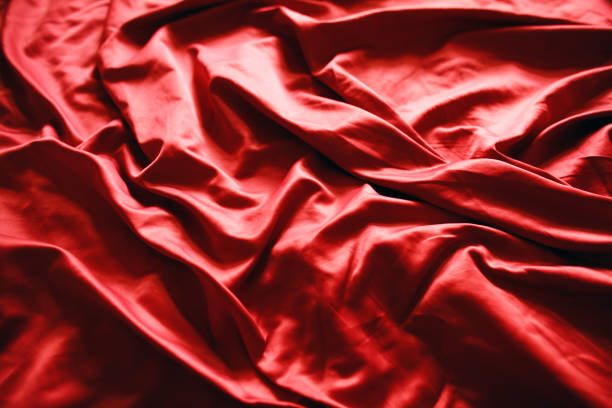 istock Abstract red satin wrinkled background textile cloth 1238714946