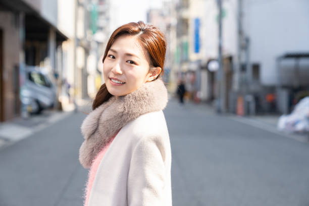 istock asian woman in a coat 1238728385