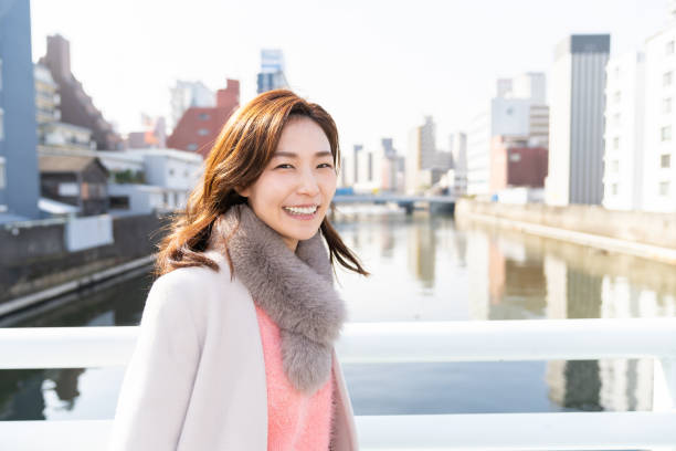 istock asian woman in a coat 1238728390