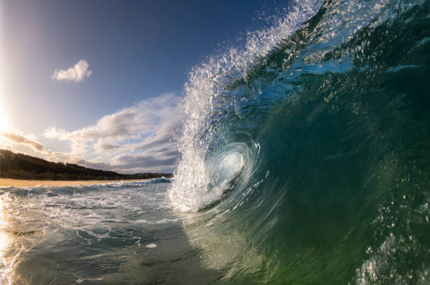 istock Splashing waves at sunrise 1238728908