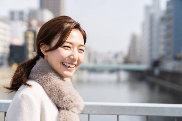 istock asian woman in a coat 1238729943