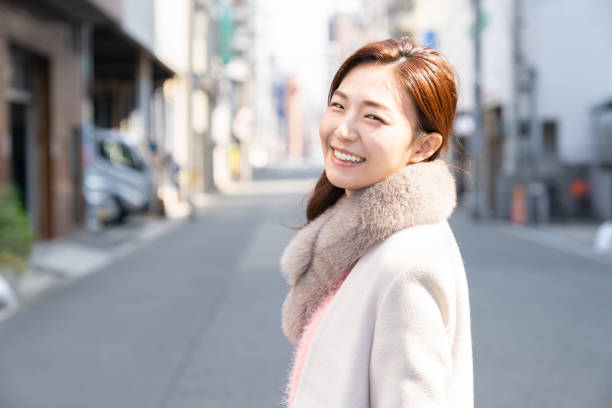 istock asian woman in a coat 1238730963