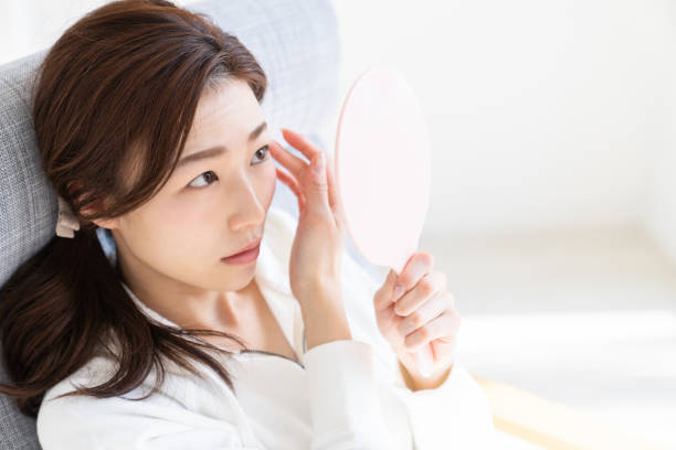 istock asian woman to see a mirror 1238731986