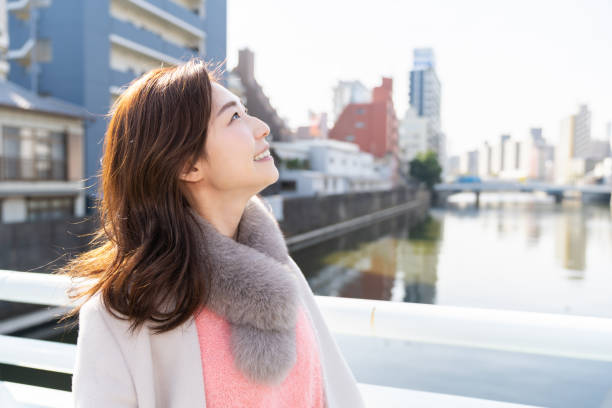 istock asian woman in a coat 1238731992