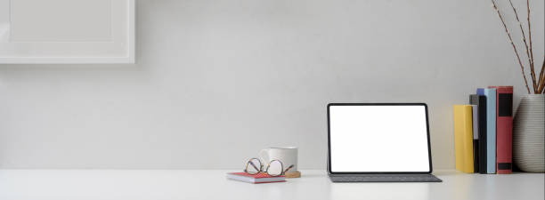 istock Modern home office desk with mock-up tablet, supplies, cup, decorations and copy space 1238771022