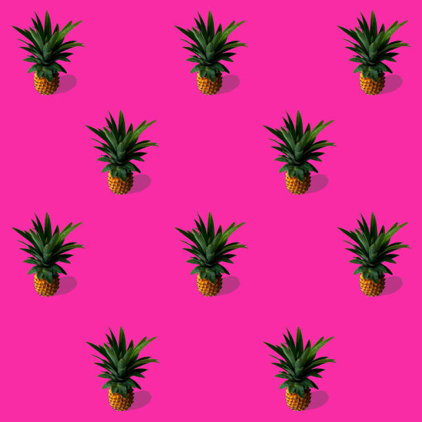 istock trend pattern with pineapples on a bright pink background, the concept of minimalism 1238798141