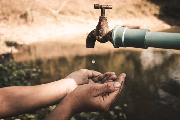 istock The boy waiting for drinking water to live through this drought, Concept drought and crisis environment. 1238915193