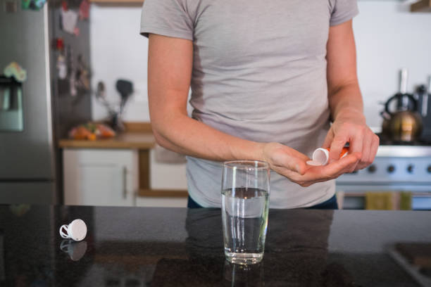 istock Woman takes a vitamin effervescent tablet with water 1238926336