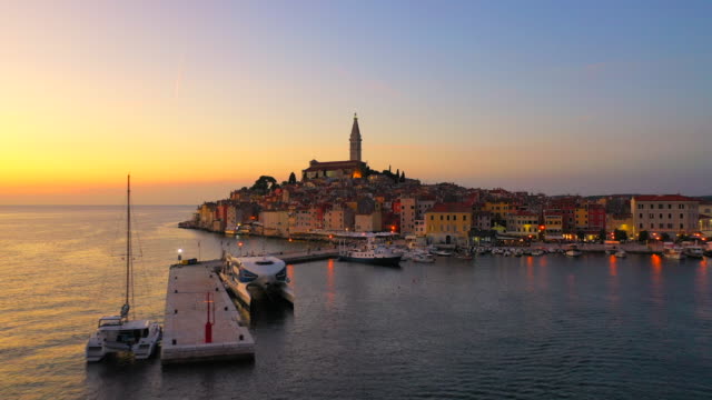 Aerial Drone View Sunset Scene of historical center of Rovinj old town, Istria region, Croatia, Europe