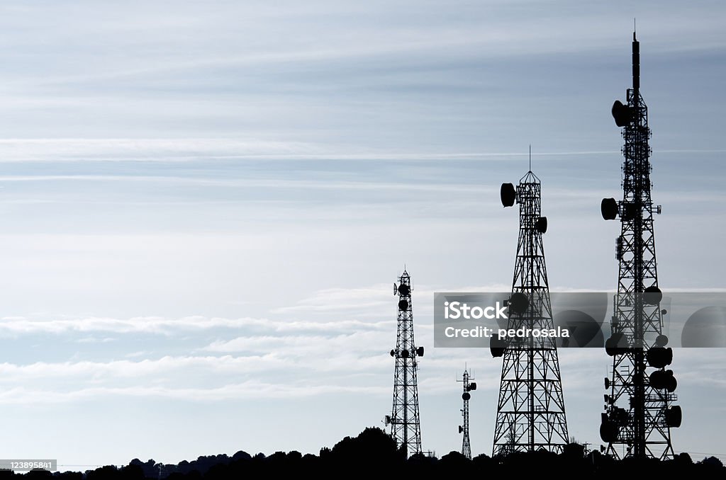 telecommunications towers silhouette of  a group of telecommunication towers Communications Tower Stock Photo