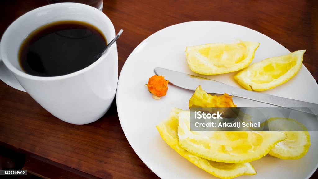 Finish eating fruits and starting drinking black coffee. Finish eating fruits and starting drinking black coffee. Food and Drink. Black Coffee Stock Photo