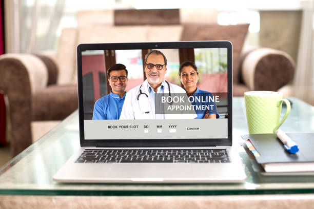 istock Booking online appointment with doctors on laptop at home 1239060348