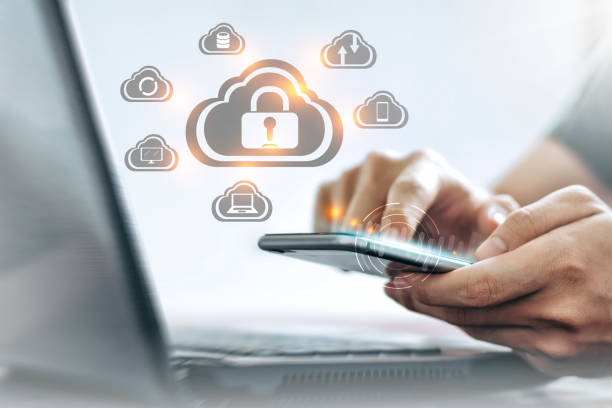 istock Young Asian man is holding a smartphone, Personal data Security lock cyber is a key safe device protection upload backup data on the cloud keep for privacy database. 1239092934