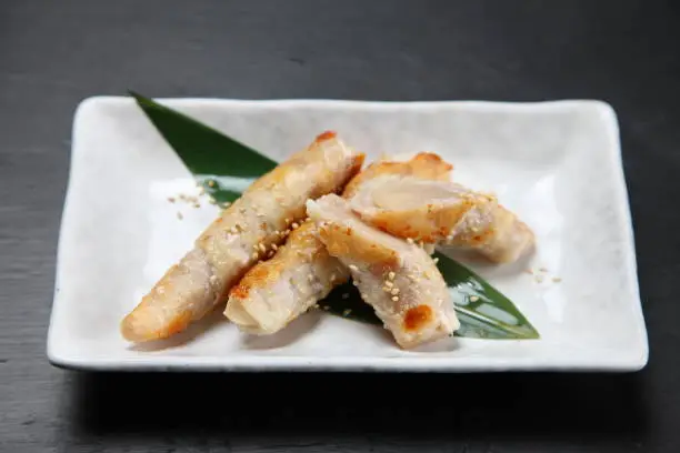 pork and ginger roll up on dark background