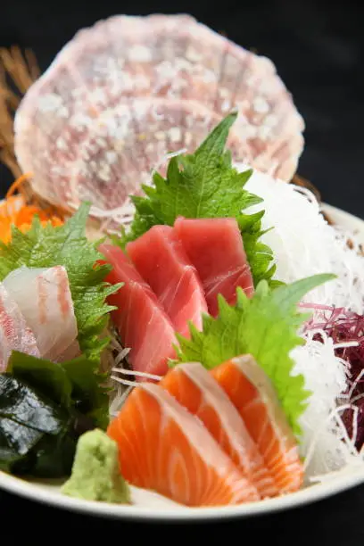 close up studio shot of  sashimi on dark background