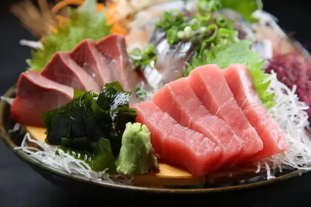 close up studio shot of seasonal fresh sashimi assorted plate