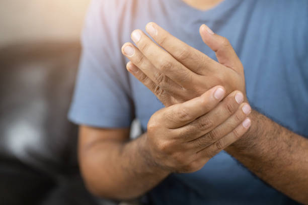 istock Men work so hard that they have office syndrome. He has wrist pain. 1239110941