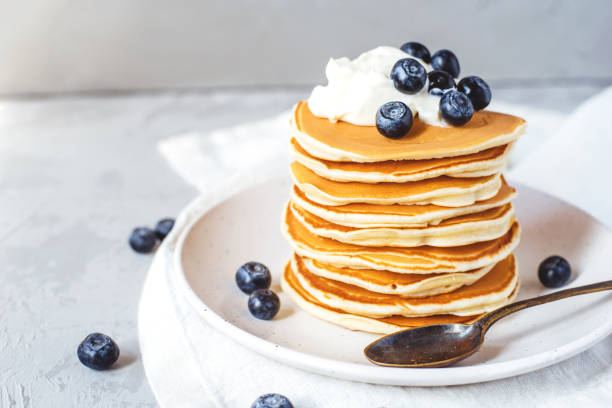 Stack of pancakes with fresh blueberry.