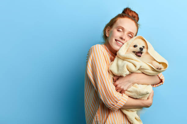 istock kind friendly girl gets pleasure from hugging her pet 1239140938