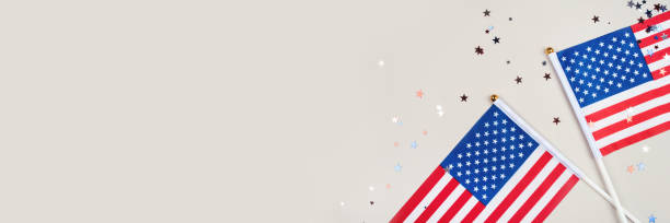 istock Festive background with US flags and confetti. 1239145343