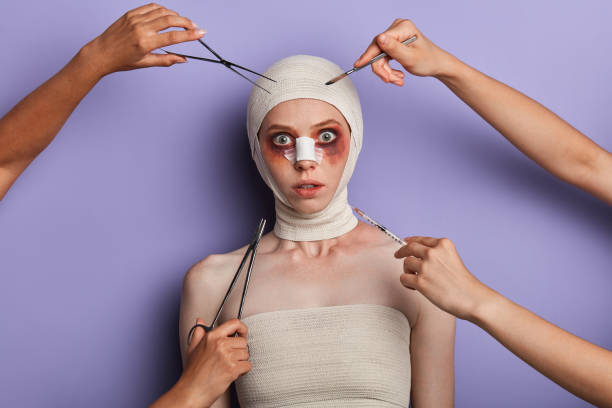 istock frightened girl wrapped into the bandage looking at the camera 1239145878