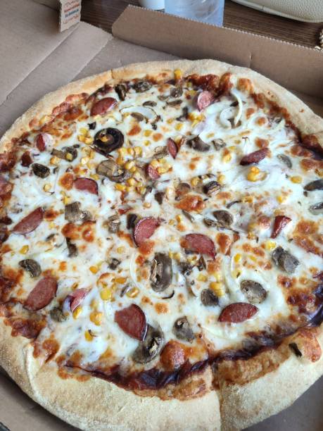 istock pizza with sausage in a cardboard box 1239172200