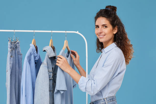 istock Woman choosing jeans clothes 1239173769