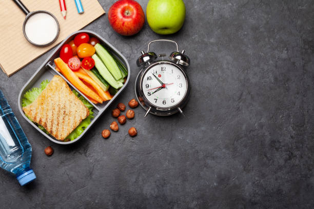 istock School lunch box and education stationery on stone table 1239183887