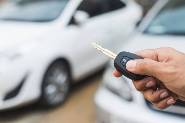 istock Hand presses on the remote control to lock car. 1239189796