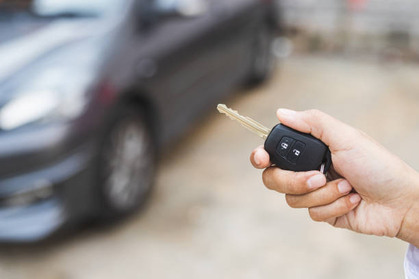 istock Hand presses on the remote control to lock car. 1239194032