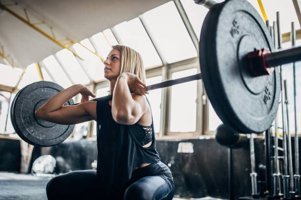 istock One strong woman weightlifting 1239235979