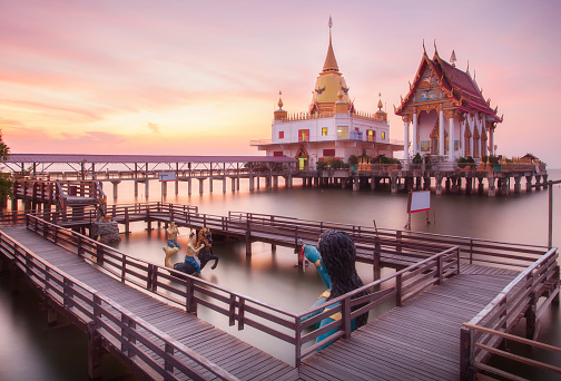 Twilight scene of Wat Hongtong, temple is float on the sea in Chachoengsao Thailand.