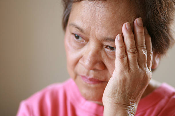 Older woman worried about the future stock photo