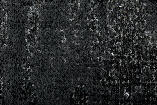 istock black festive background texture of shiny sequins. 1239270999