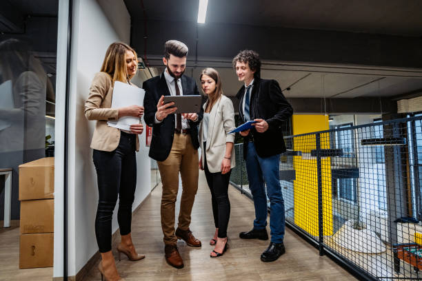 istock Businesspeople having a meeting in hallway 1239284043