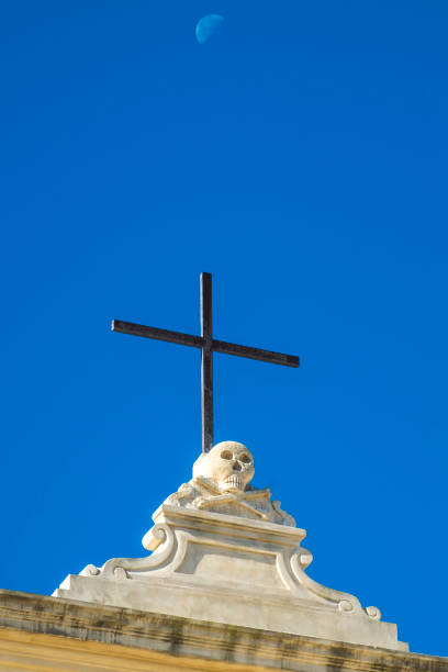 istock Low Angle View Of Cross Against Clear Blue Sky 1239311273