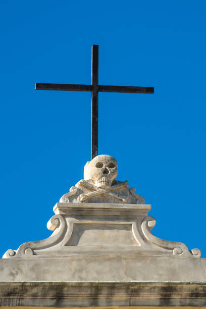 istock Low Angle View Of Cross Against Clear Blue Sky 1239311275