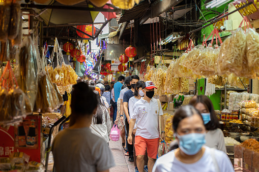 Crowd of people walking shopping for Chinese food resource in Chinatown Yaowarach market and waring face mask for protect Coronavirus(Covid-19). 30 May 2020, Bangkok, THAILAND.